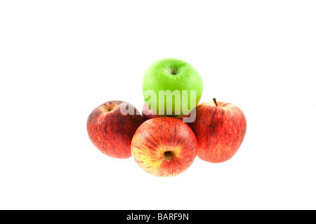 four red and one green apples on a white background Stock Photo