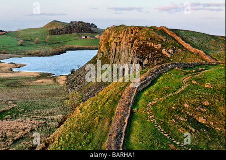 Looking east along Hadrian's Wall over Sycamore Gap towards Highshields Crag, Crag Lough and Hotbanks in Northumberland National Park Stock Photo