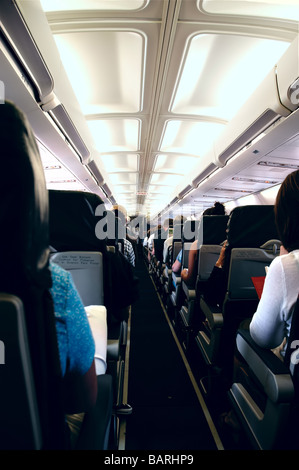 Passengers onboard an airplane Stock Photo