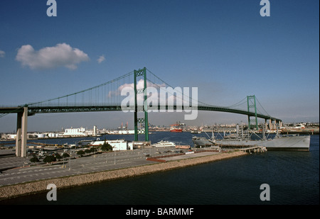 Victory ship in Los Angeles harbor  and Vincent Thomas Bridge Stock Photo