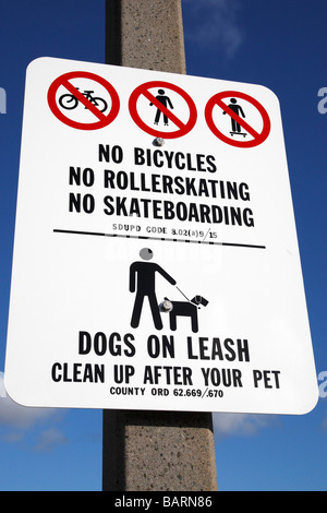no bicycles no roller skating no skateboarding, dogs on a leash road sign along shelter island drive san diego california Stock Photo