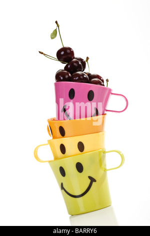 Sour cherries in plastic mugs Stock Photo
