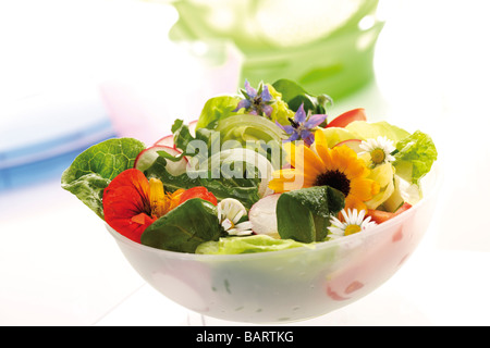 Mixed salad with edible flowers Stock Photo