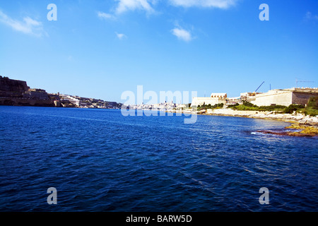 View of Manoel Island and fortifications, taken from the Sliema to Valetta ferry, crossing Marsamxett Harbour mid morning. Stock Photo