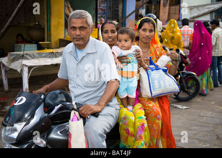 Family riding on a motorcycle in Sardar Market, Jodhpur, Rajasthan, India Stock Photo