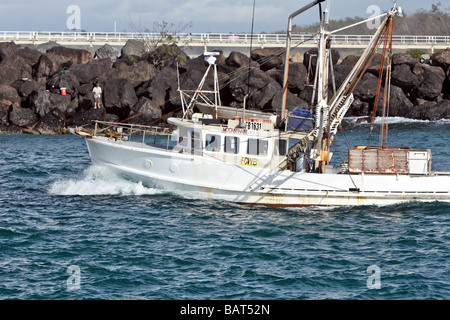 Trawler putting to sea Stock Photo