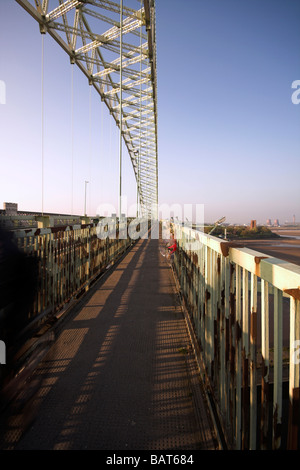 Motorists on the Silver Jubilee Bridge over the River Mersey and Manchester Ship Canal at Runcorn Gap, Cheshire, UK Stock Photo