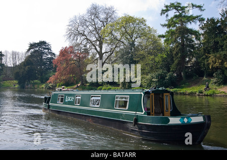 Horizontal wide angle of a traditional narrowboat navigating the River Avon on a sunny day Stock Photo