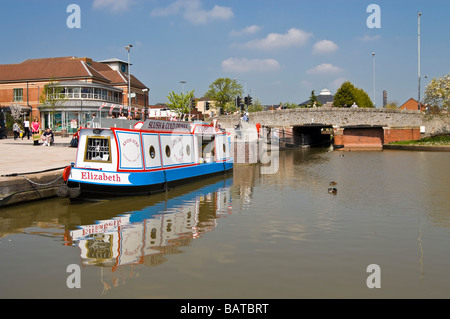 Horizontal wide angle of an old fashioned narrow boat moored in the Canal basin of the river Avon on a bright sunny day Stock Photo