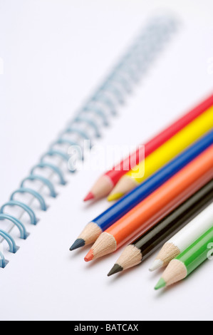 Spiral notebook and colored pencils Stock Photo