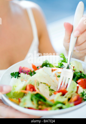 Healthy eating. Woman eating agreen salad. Stock Photo