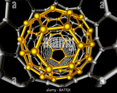 Carbon nanotube and buckyball. Computer artwork showing the hexagonal carbon structures of abuckyball (yellow) Stock Photo