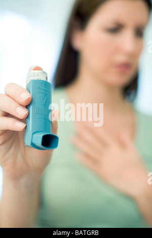 Close up of a blue asthma inhaler isolated on the white background ...