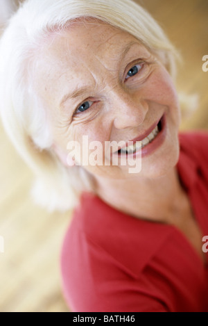 Smiling woman. 63 year-old woman looking happy. Stock Photo