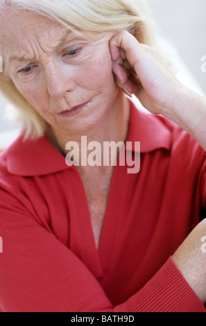 Depressed woman.63 year old woman looking unhappy. Stock Photo