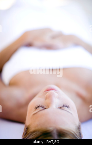 Woman relaxing at a spa. She is 26 years old. Stock Photo