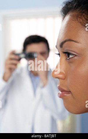 Cosmetic surgery. Consultant takes a photograph of his patient before he undergoes cosmetic surgery. Stock Photo