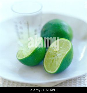 Squeezed lime (Citrus aurantifolia). The lime has been squeezed for its juice. Stock Photo