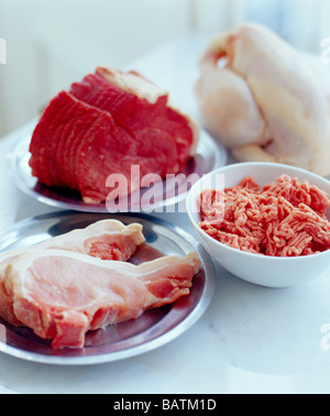Assorted meats. Chicken (upper right), beef (upper left), minced lamb (centre right) and pork chops (lower left). Stock Photo