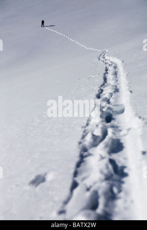 USA, Colorado, Aspen, Person walking in snow up mountain Stock Photo