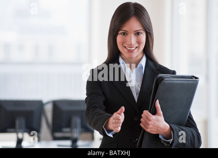 Businesswoman ready to shake hands Stock Photo