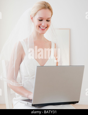 Young bride surfing on internet Stock Photo