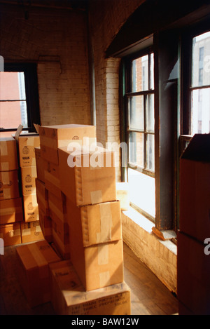 Stacked cardboard boxed in house Stock Photo