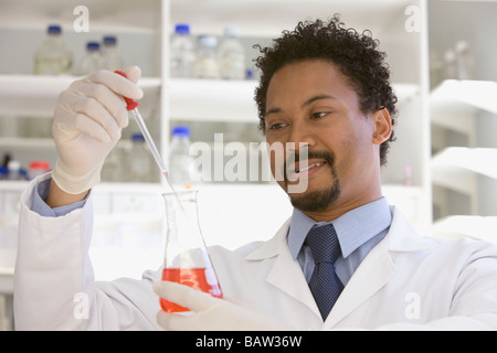African scientist performing analysis in laboratory Stock Photo