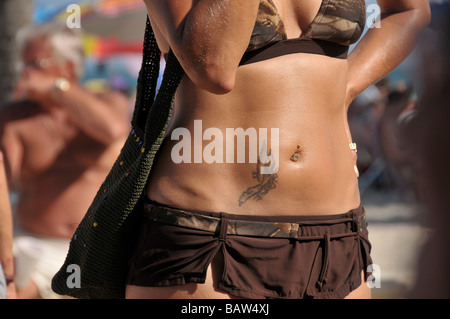 Hollywood, Florida USA beach scene woman's pierced abdomen. Stock Photo