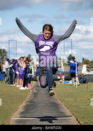 A middle school girl s long jump at a track and field meet in Bend Oregon Stock Photo