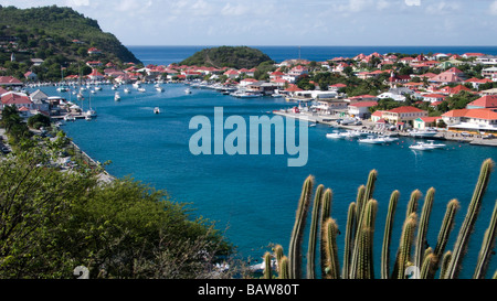 Red tin roof buildings surround Gustavia port St Barts Stock Photo