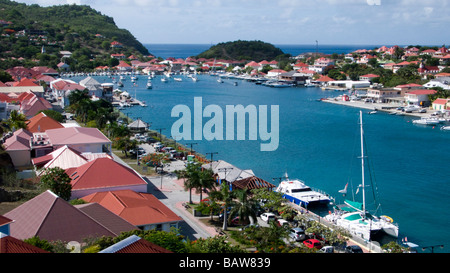 Red tin roof buildings surround Gustavia port St Barts Stock Photo