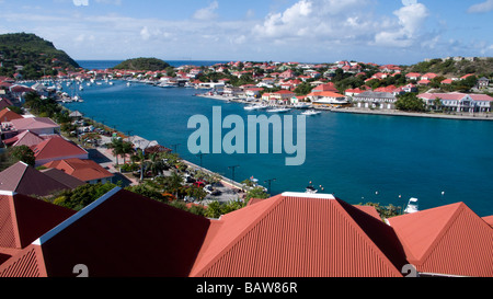 Red tin roof buildings surround Gustavia port St Barts Stock Photo