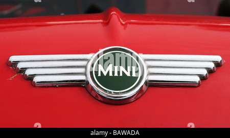 Classic British racing green Mini cooper badge/logo on red bonnet bodywork Stock Photo