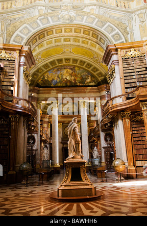 interior of the Baroque State Hall of National Library in Vienna Austria with the beautiful arches, columns and frescoes. Stock Photo