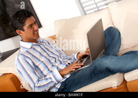 man on a laptop at home Stock Photo