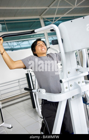 Man doing chin ups Stock Photo