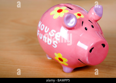 piggy bank on a wooden surface Stock Photo