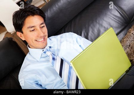 business man on a laptop at home Stock Photo