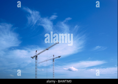 Tower Cranes against blue sky Stock Photo