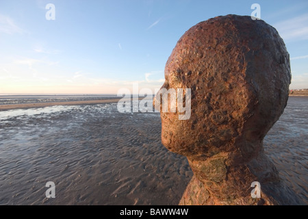 British artist Anthony Gormley's 'Another Place' sculptures at Crosby Sands Sefton near Liverpool England. Stock Photo