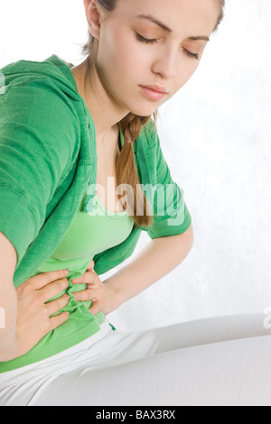 young woman with stomach ache Stock Photo