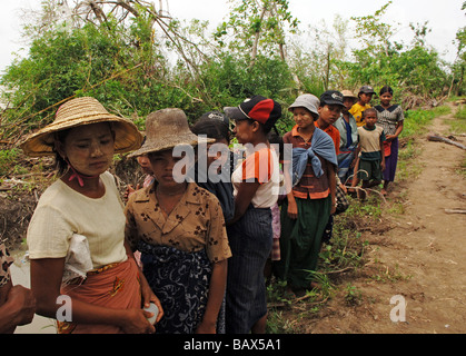 Survivors wait for food in Bogale after cyclone Nargis struck Myanmar between the 2nd and 3rd of May 2008 Stock Photo
