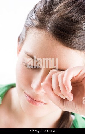 young woman rub eyes Stock Photo