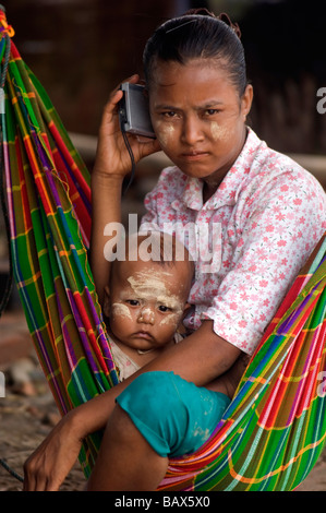 Cyclone survivors listen to a radio after Cyclone Nargis struck Myanmar between the 2nd and 3rd of May 2008 Stock Photo