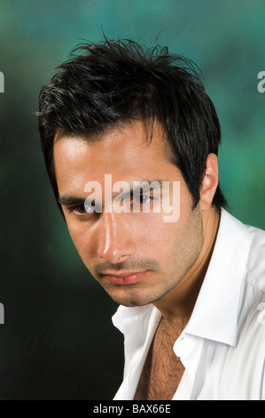 Pensive young Asian man Stock Photo
