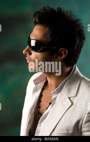 Man wearing sunglasses looking away Stock Photo
