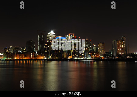 London's financial district including Canary Wharf, HSBC and Barclays taken at night. Stock Photo