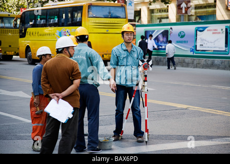 Surveyor's assistant in Pudong District Shanghai China Stock Photo