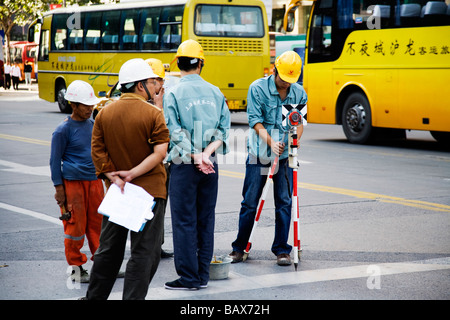 Surveyor' assistant  in Pudong District Shanghai China Stock Photo